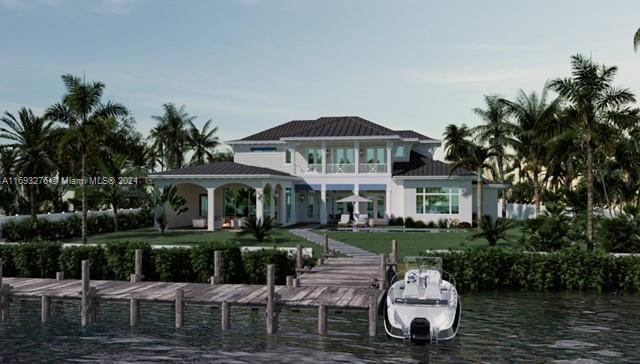 view of dock featuring a lawn and a water view