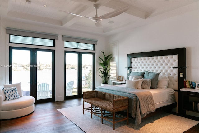 bedroom with beam ceiling, ceiling fan, french doors, dark hardwood / wood-style floors, and access to outside