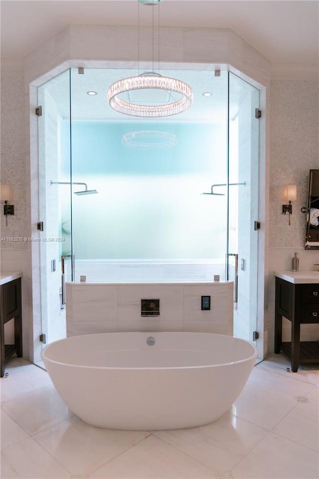 bathroom featuring plus walk in shower, vanity, tile walls, and an inviting chandelier