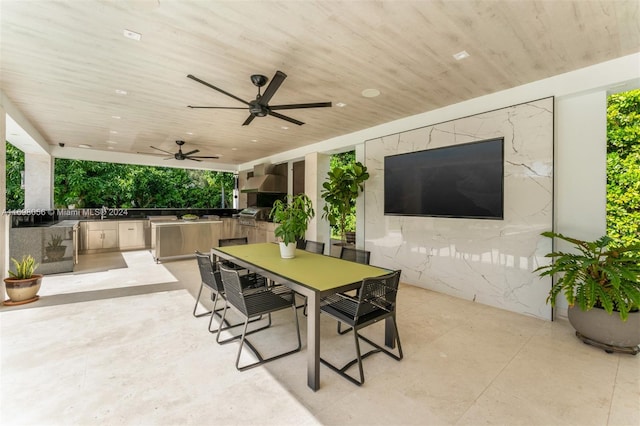 view of patio featuring area for grilling, grilling area, and ceiling fan