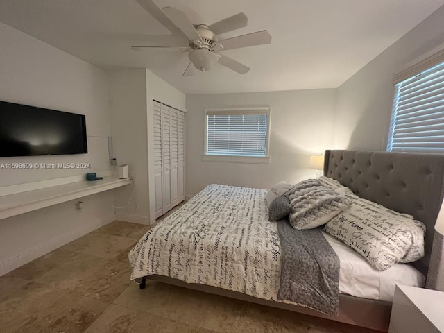 bedroom featuring ceiling fan and a closet