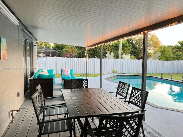 view of patio / terrace featuring a fenced in pool and outdoor lounge area