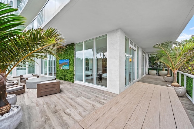 wooden terrace featuring outdoor lounge area