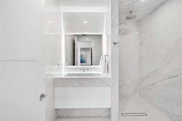 bathroom featuring vanity and a tile shower