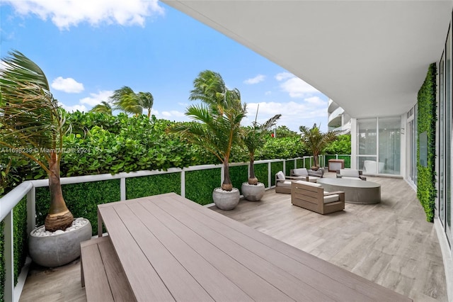 wooden terrace featuring an outdoor living space