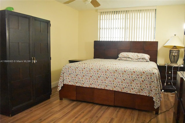 bedroom with hardwood / wood-style floors and ceiling fan