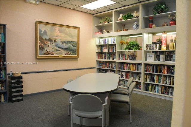 office area with a paneled ceiling and carpet