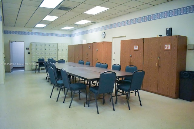 dining room with a drop ceiling