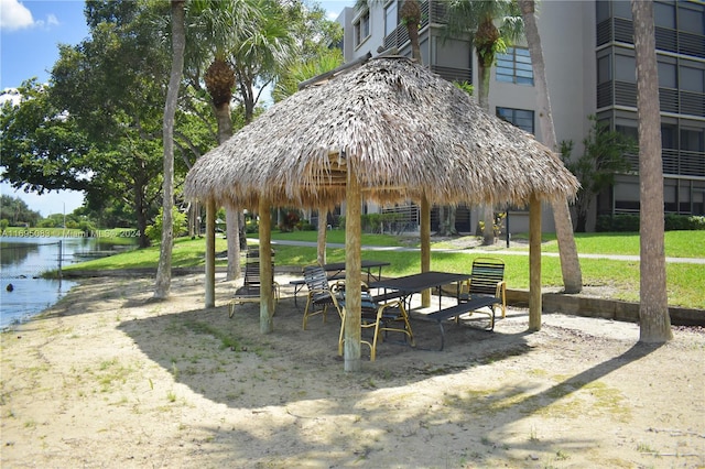 view of property's community featuring a gazebo and a water view