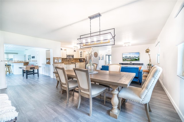 dining space featuring dark hardwood / wood-style flooring