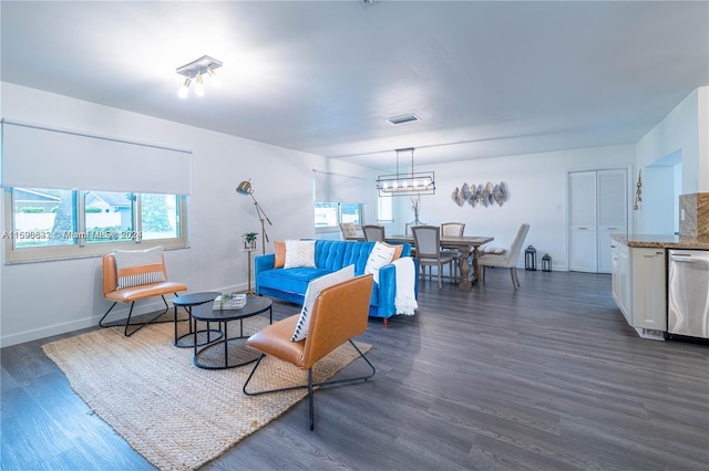 living room with dark hardwood / wood-style floors