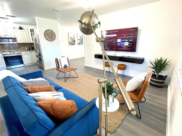 living room with dark hardwood / wood-style flooring