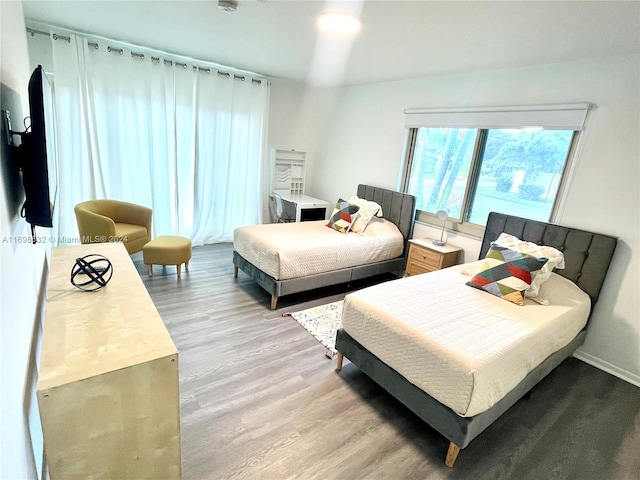 bedroom with light hardwood / wood-style floors