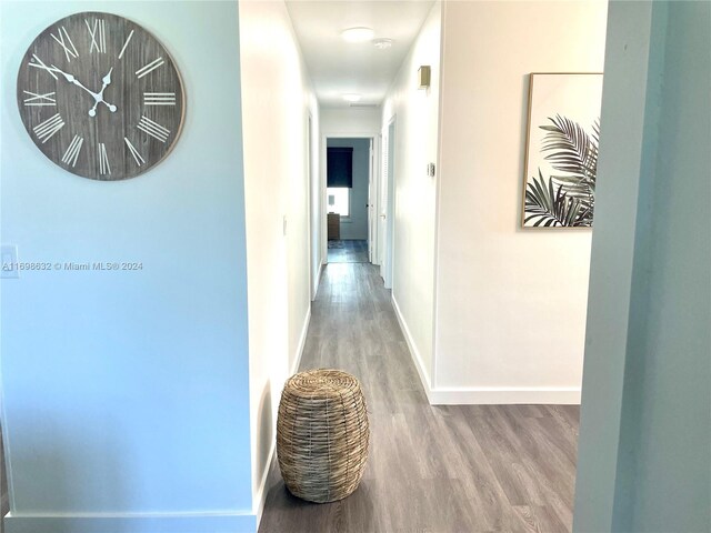 hallway featuring hardwood / wood-style flooring