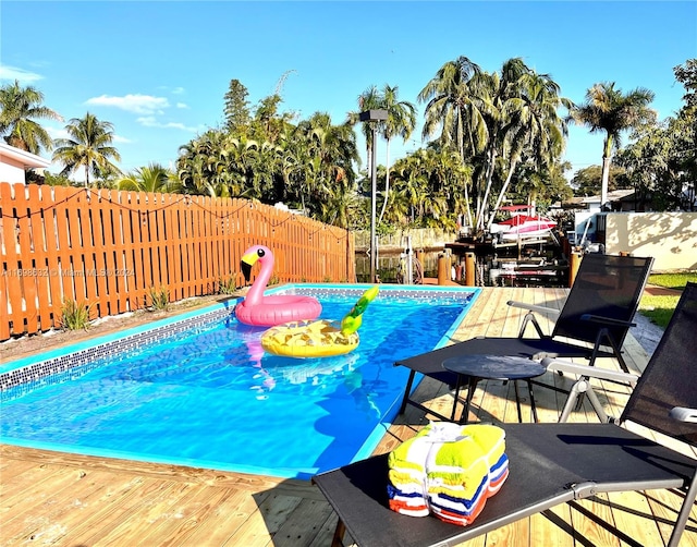 view of pool with a wooden deck