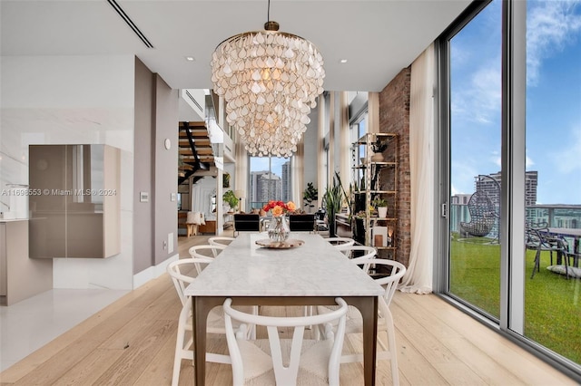 dining area featuring a chandelier and light hardwood / wood-style floors