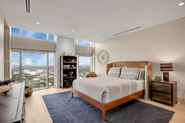 bedroom with light hardwood / wood-style flooring