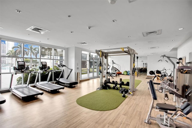 gym with hardwood / wood-style floors