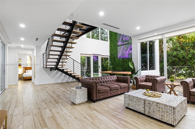 1816 SW 23rd St, Miami, FL 33145 - living area with stairs, wood finished floors, recessed lighting, and healthy amount of natural light