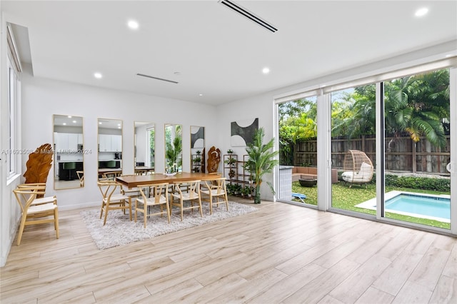 unfurnished dining area featuring light hardwood / wood-style flooring