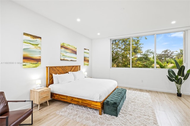 bedroom with light hardwood / wood-style floors