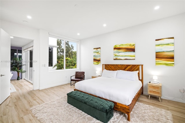 bedroom with light hardwood / wood-style flooring