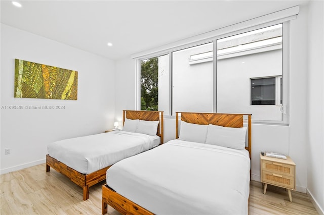 bedroom with light hardwood / wood-style flooring