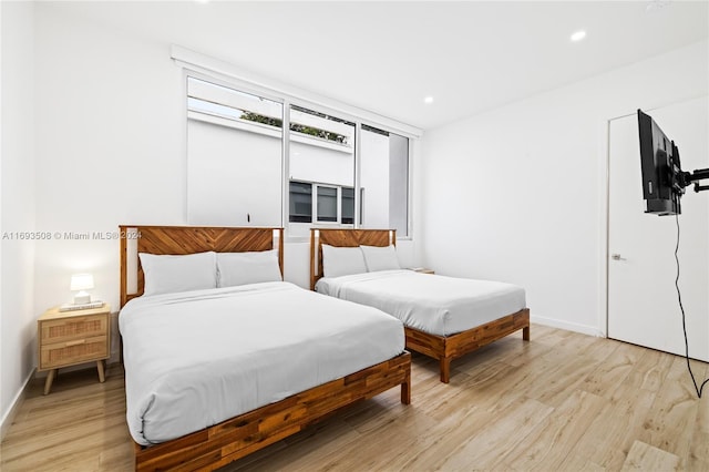 bedroom featuring light hardwood / wood-style floors