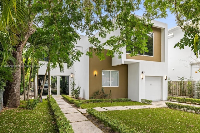1816 SW 23rd St, Miami, FL 33145 - view of front of home featuring stucco siding and a garage