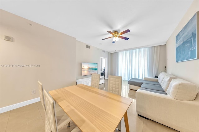 tiled living room with ceiling fan