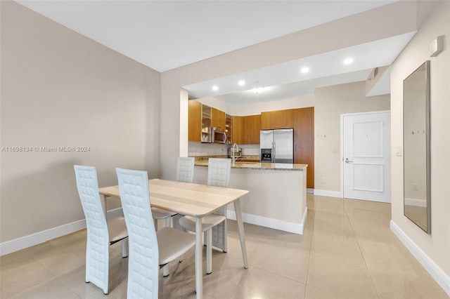 tiled dining space with sink