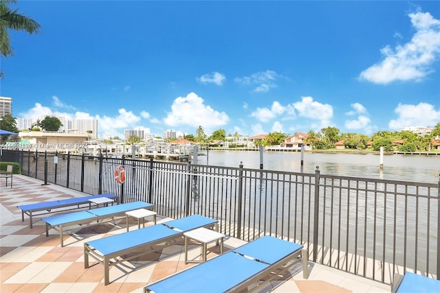 view of patio with a water view