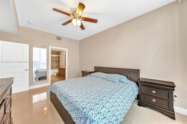 bedroom featuring light tile patterned floors, ensuite bath, and ceiling fan