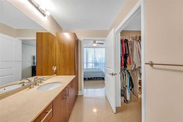 bathroom featuring tile patterned flooring, vanity, and ceiling fan