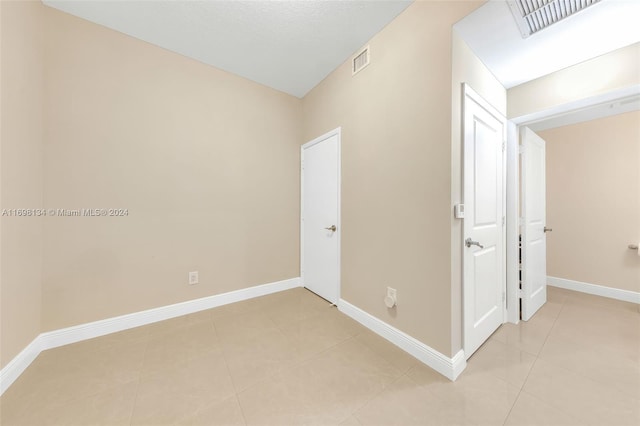 view of tiled spare room