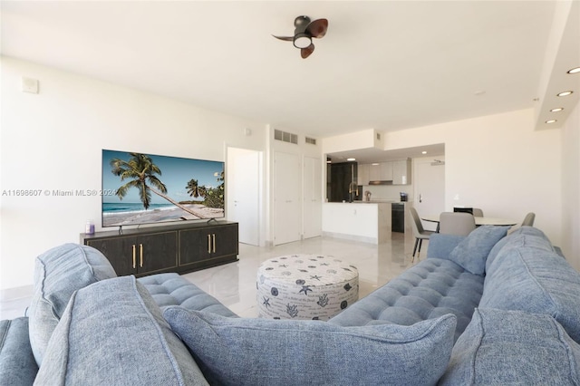 tiled living room featuring ceiling fan