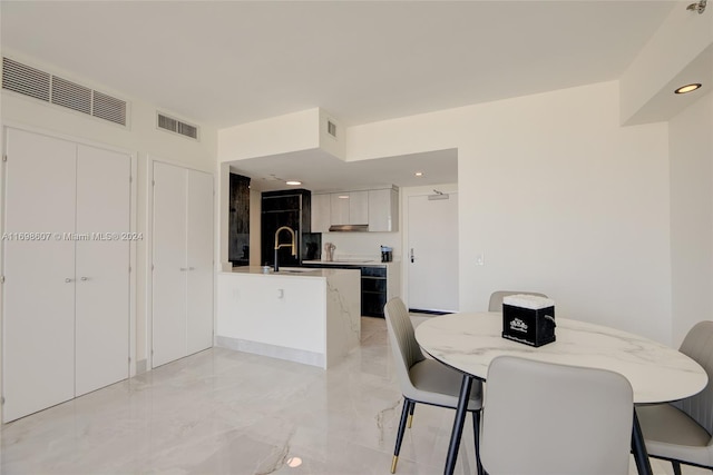 dining room featuring sink