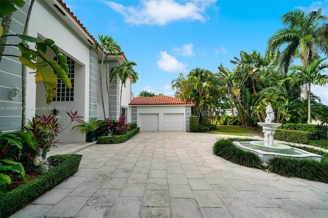 view of patio featuring a garage