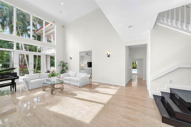 living room featuring high vaulted ceiling, plenty of natural light, ornamental molding, and ceiling fan