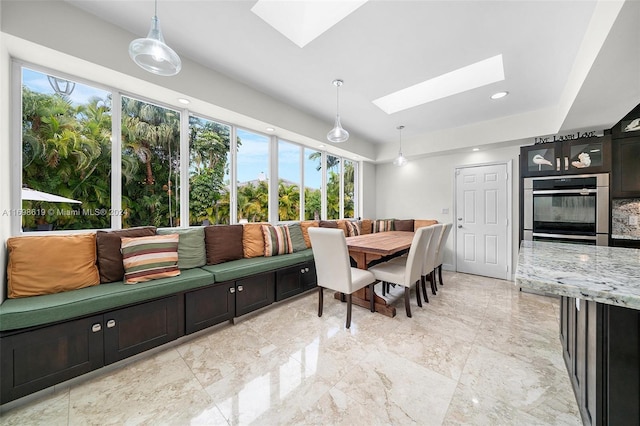 dining room with a skylight