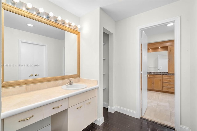 bathroom with vanity and wood-type flooring