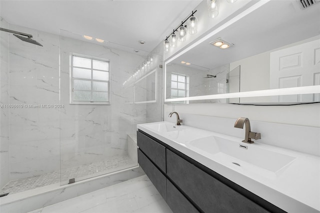 bathroom featuring vanity and tiled shower