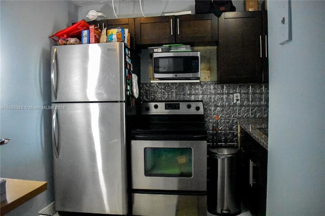 kitchen featuring appliances with stainless steel finishes, backsplash, and dark stone counters