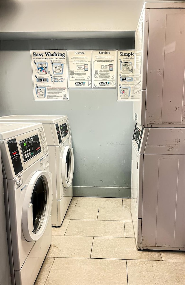 laundry area with washing machine and dryer and stacked washer / drying machine