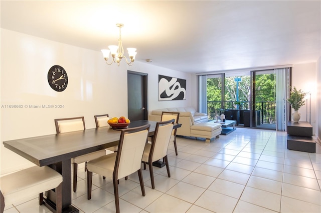 tiled dining room with expansive windows and a notable chandelier