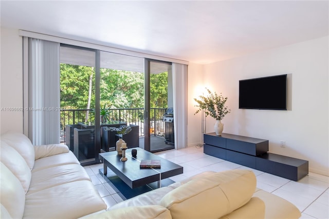 living room featuring floor to ceiling windows and light tile patterned flooring