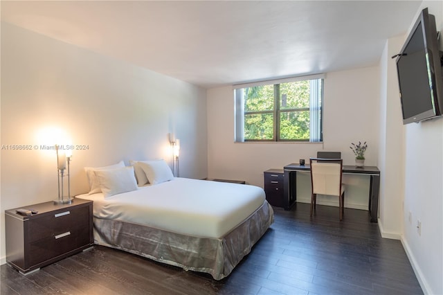 bedroom featuring dark hardwood / wood-style flooring