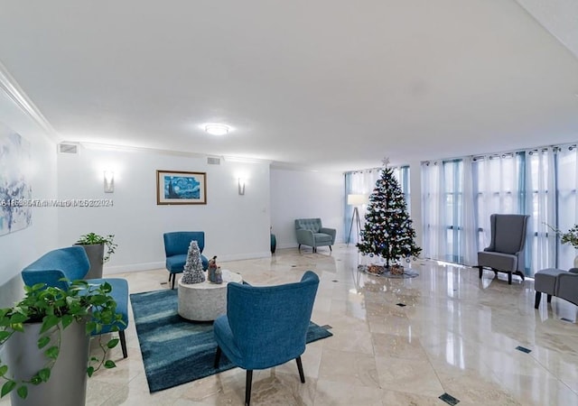 sitting room with ornamental molding