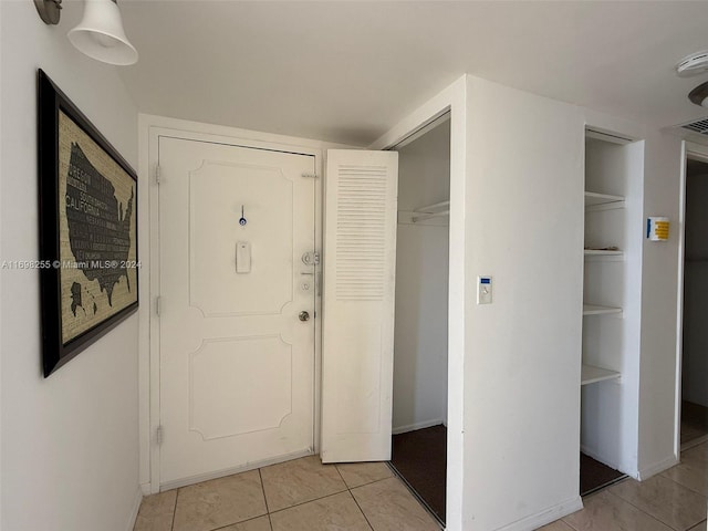 view of tiled foyer entrance