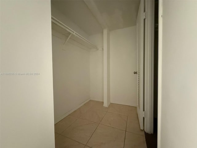 walk in closet featuring light tile patterned floors